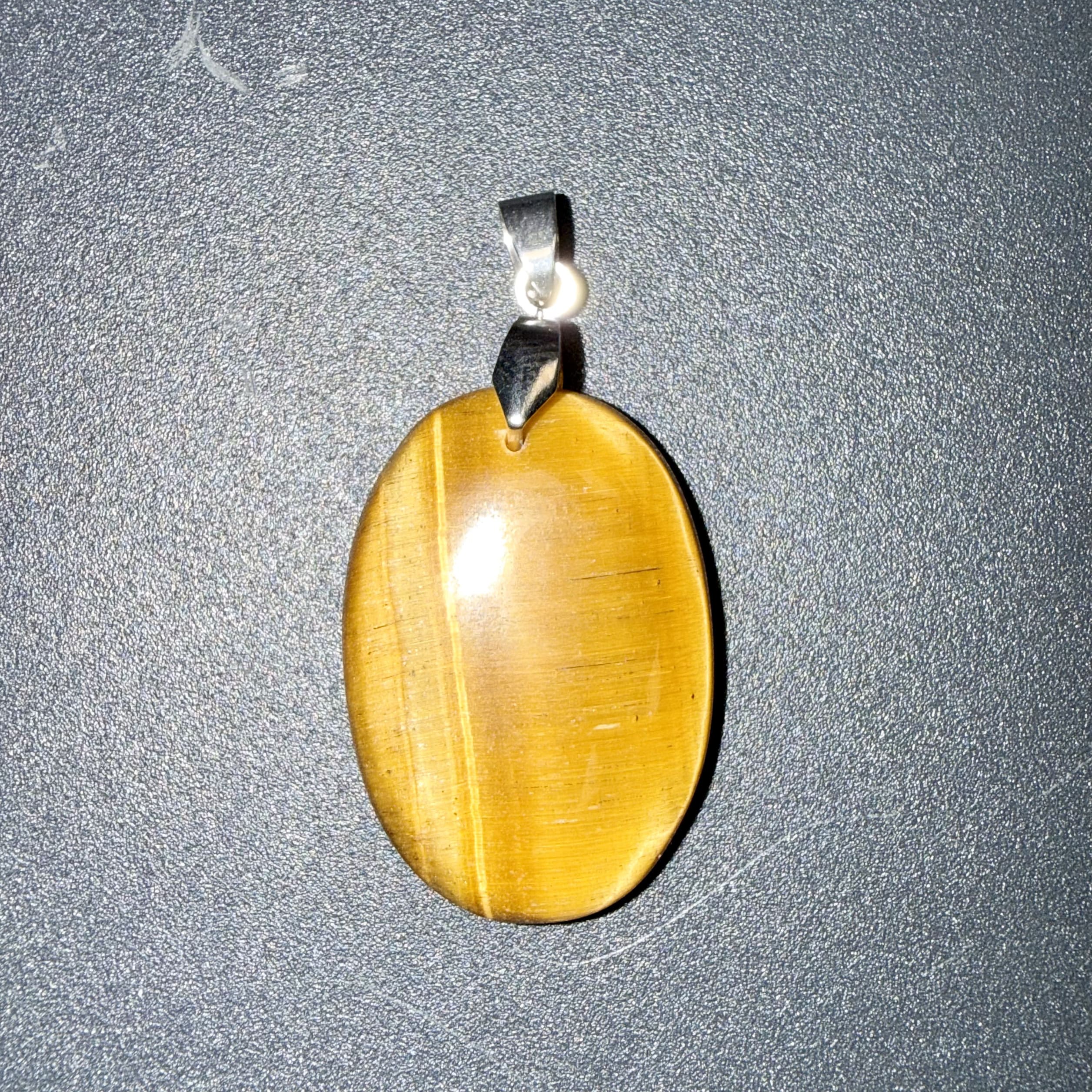 Pendentif poli en Œil de tigre – courage & protection