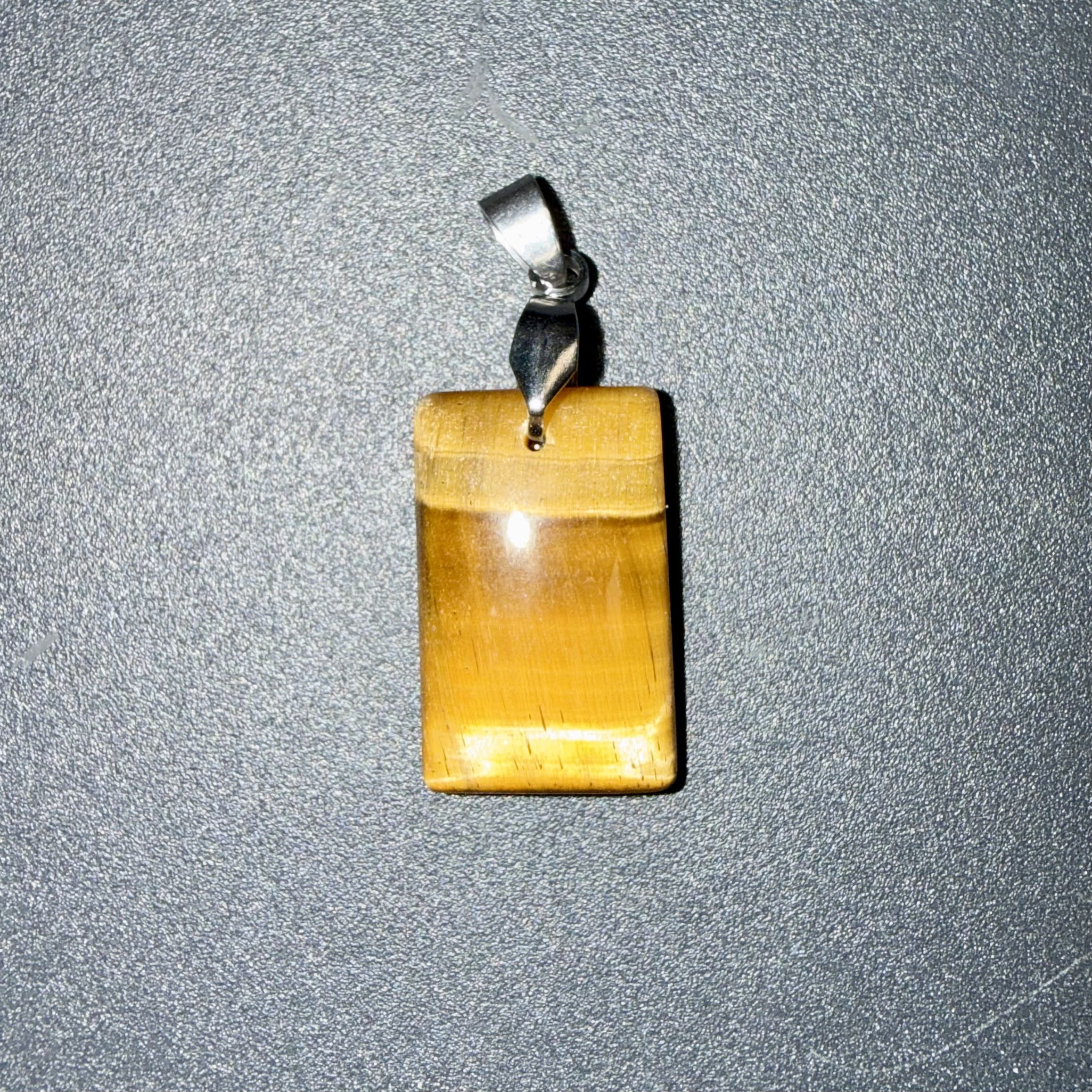 Pendentif poli en Œil de tigre – courage & protection